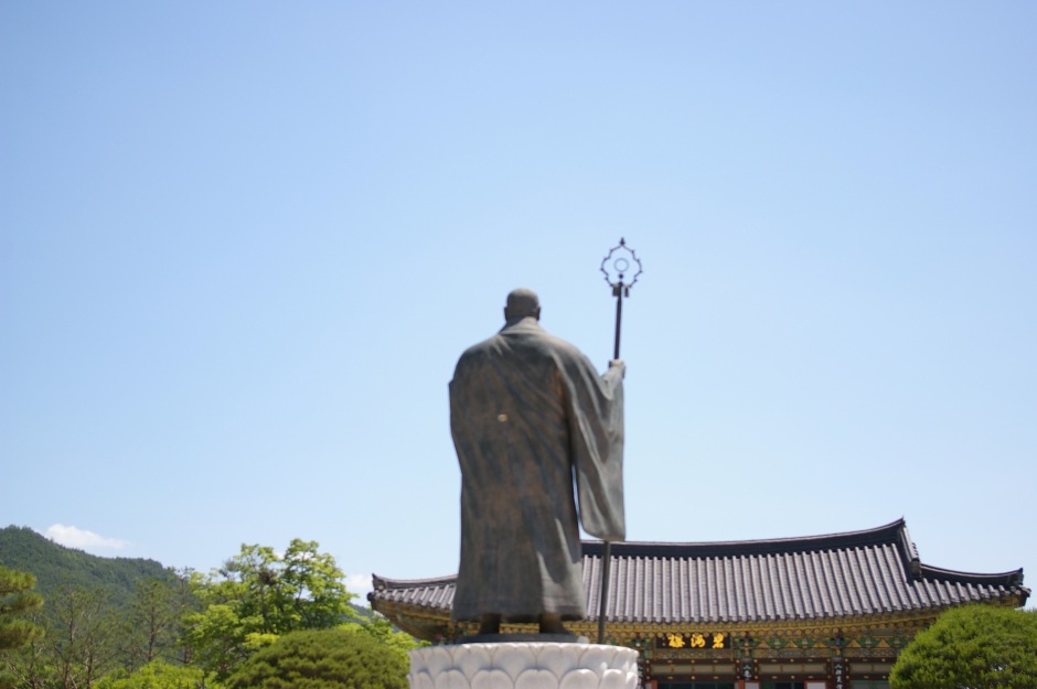 A statue watches over a Buddhist temple